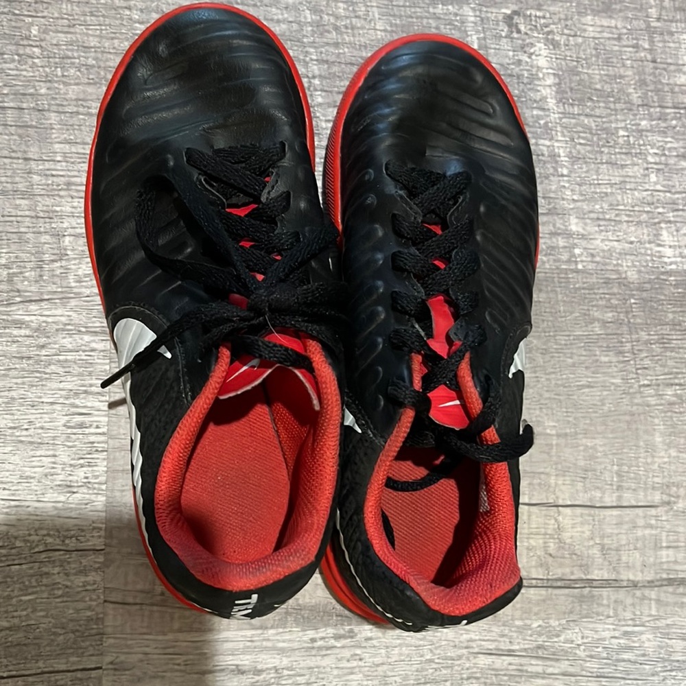 Black and red indoor soccer shoes. Size 1Y